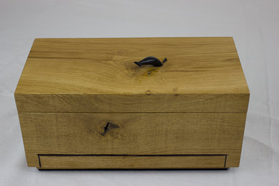 Top and front of solid oak block jewellery box by Reuben's woodcraft